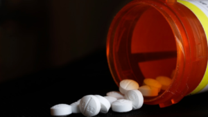 A bottle of spilled pills